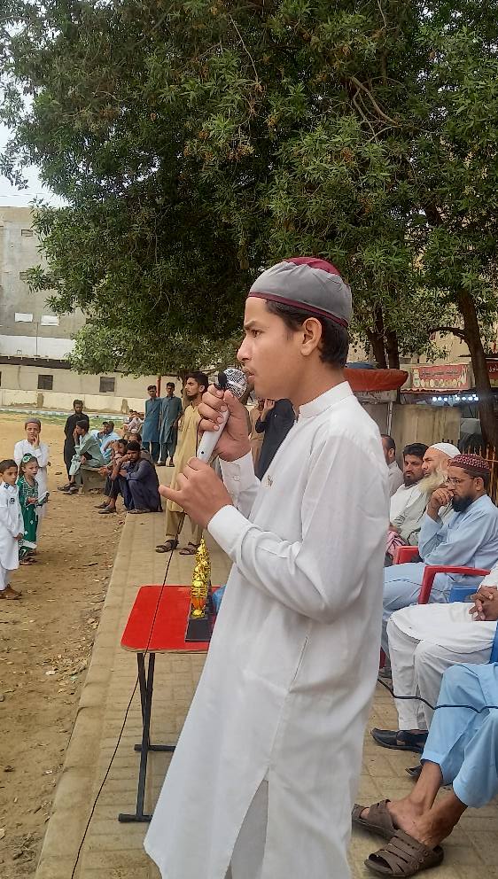 Person sitting in a modern building with a scenic view