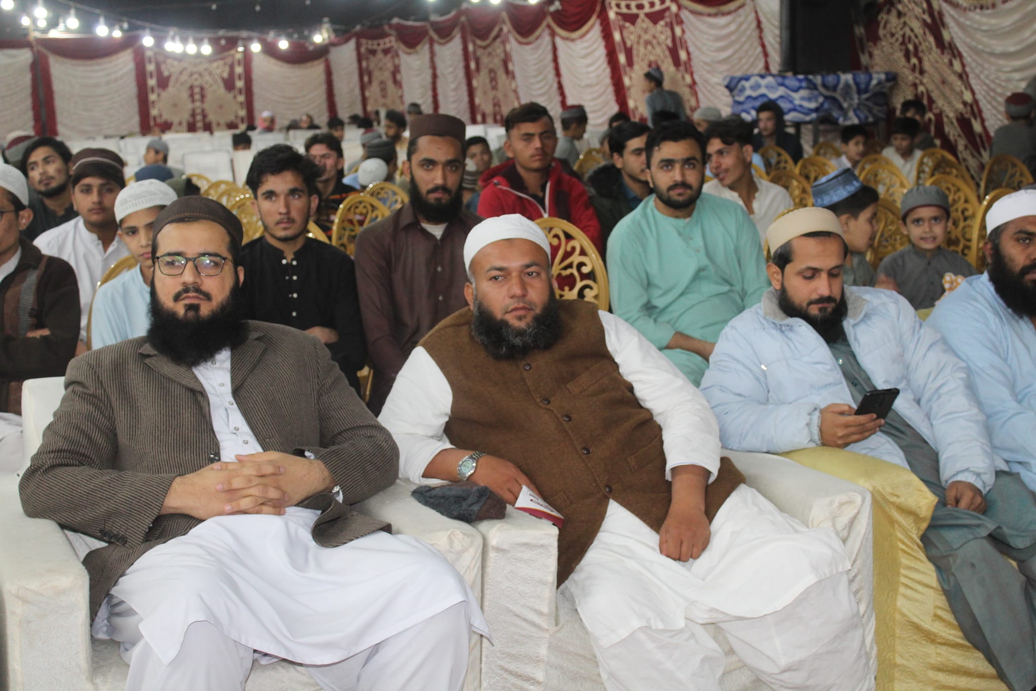 Person sitting in a modern building with a scenic view