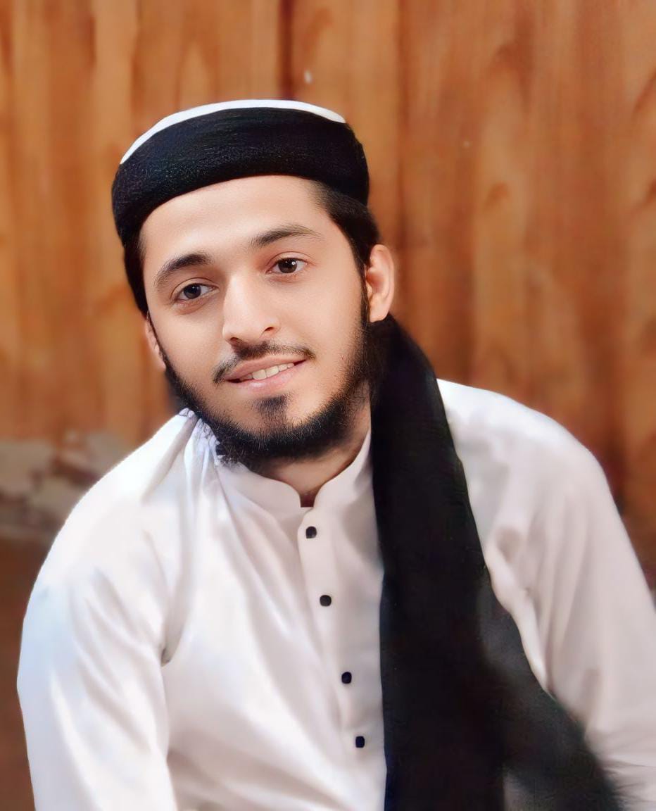 A set of law books, a clock, and a golden balance scale on a desk